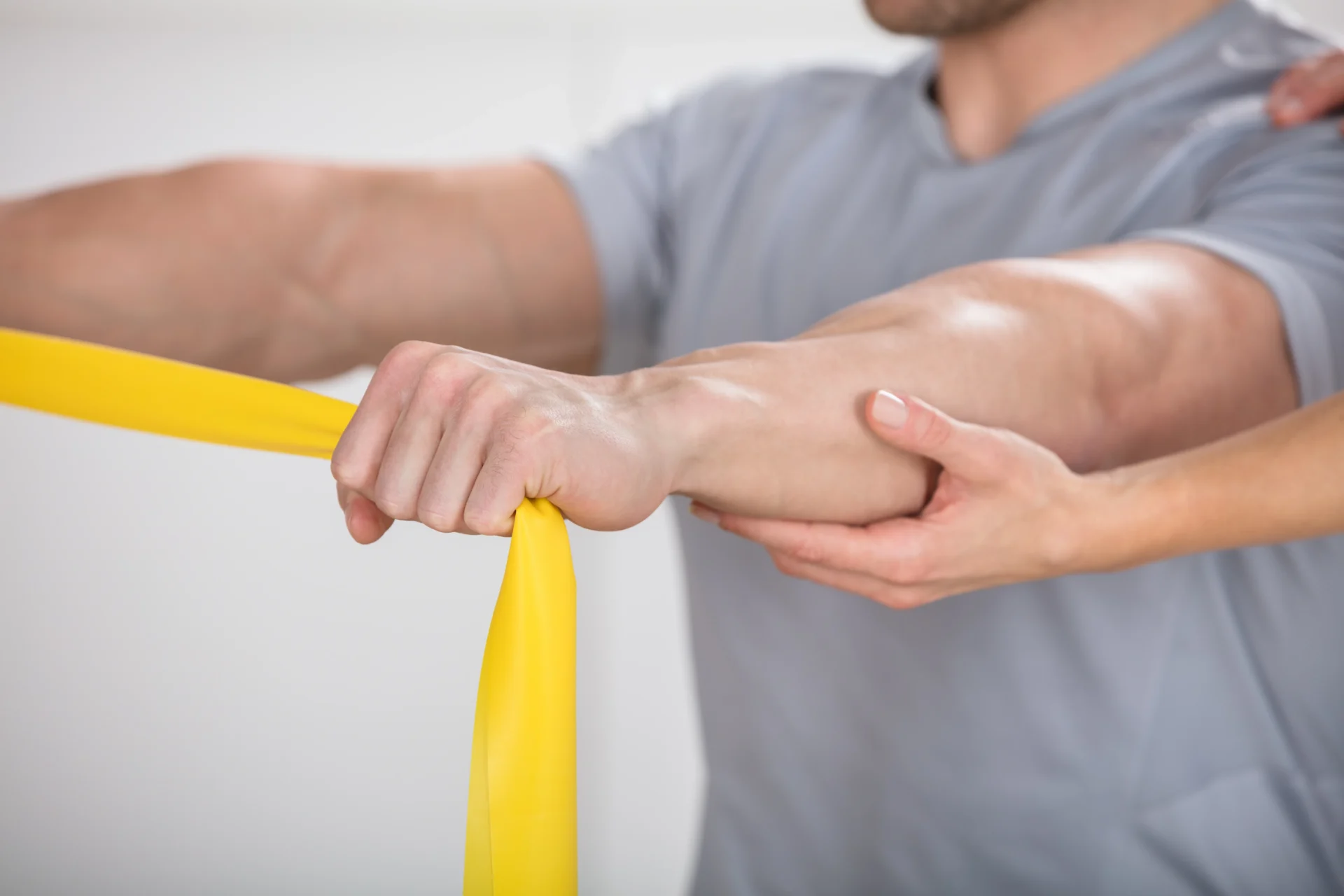 Trainer arm exercises with resistance band.